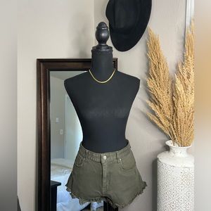 Dark green distressed shorts